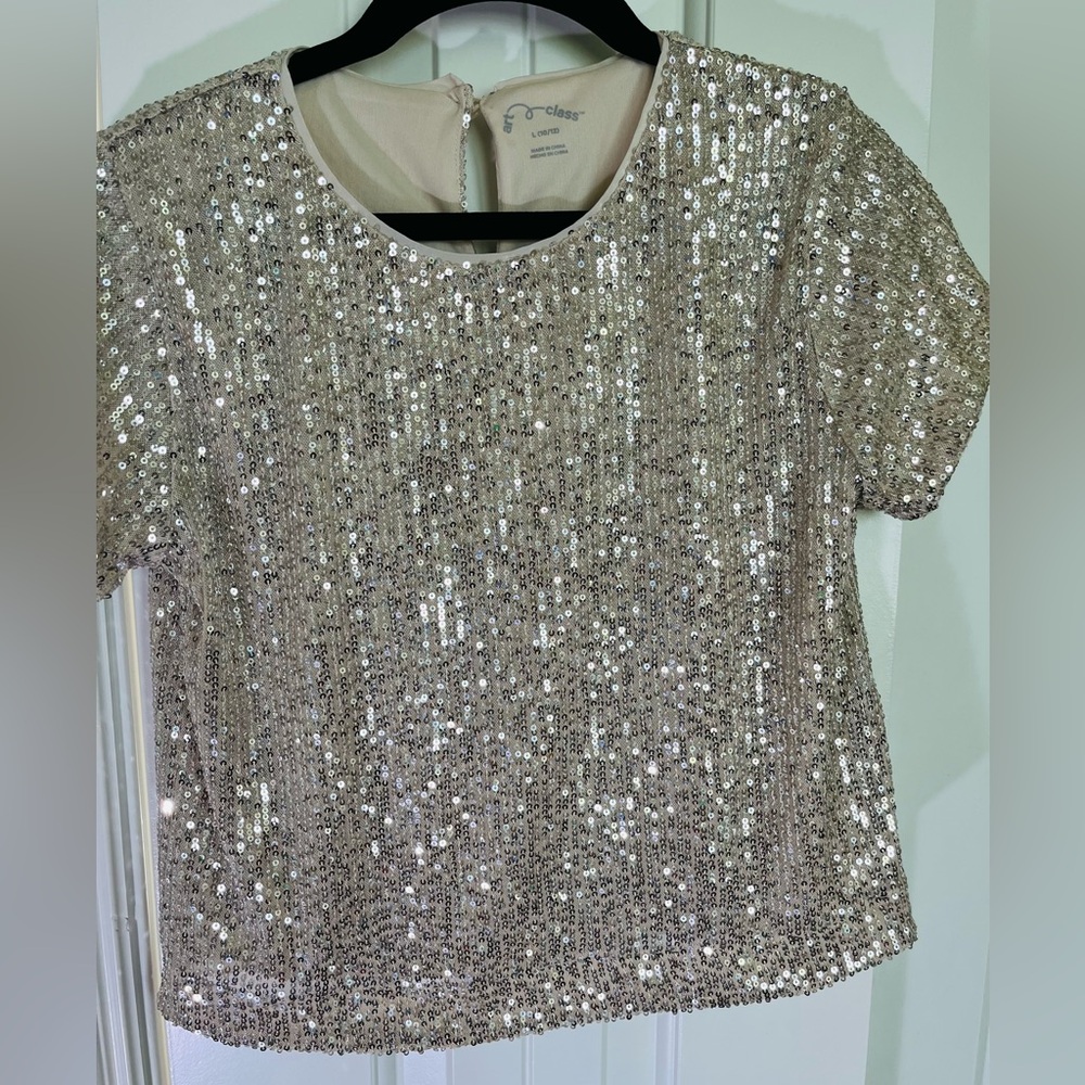 Gold sequins set with wide leg pants and top.